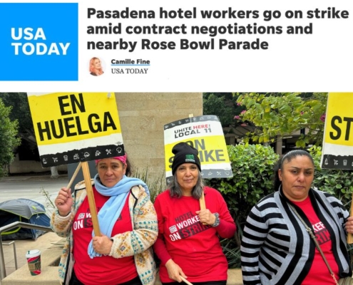 Masthead of USA Today with photo of three women in red shirts holding picket signs that say "On Strike" and "En Huelga" in black text on a yellow background