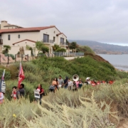 Local 11 worker leaders march through protected coastal access near the non-union Terranea Resort in 2019