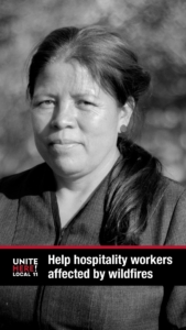 Black and white portrait of a uniformed hotel housekeeper. She is Latina with brown hair parted down the center and in a ponytail over her shoulder. She is standing in a park looking at you at a 3/4 pose. Text on image: "Help UNITE HERE Local 11 hospitality workers affected by wildfires."