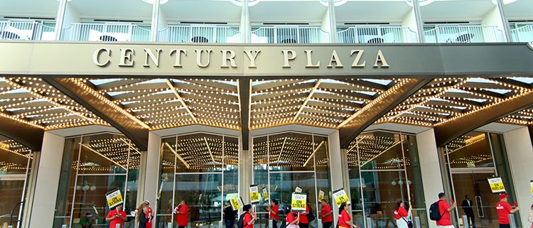 Hotel workers on strike picket in front of the Hyatt Century Plaza hotel